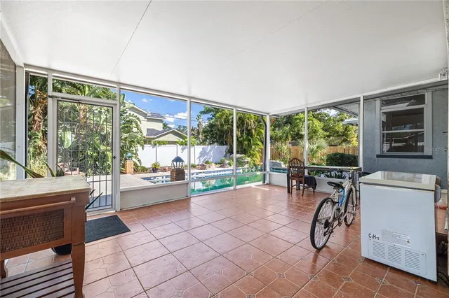 a view of a livingroom with wooden floor and entryway