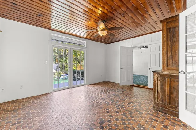 a bathroom with a toilet and a shower curtain