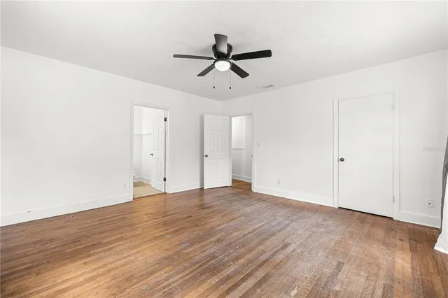 a view of a livingroom with furniture and an empty room