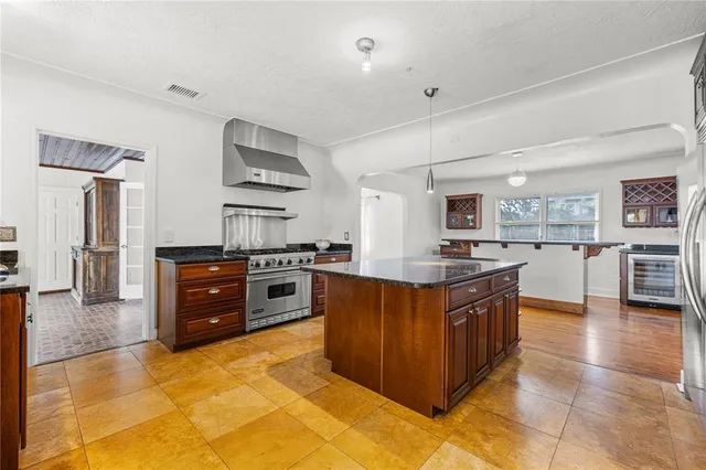 a view of a patio with dining table and chairs