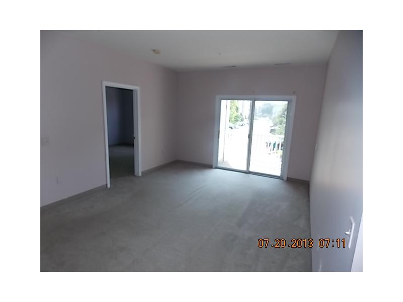 118 Mill Street, Unit 204 Woonsocket, RI 02895 - Photo 3 of 7 Living Room.