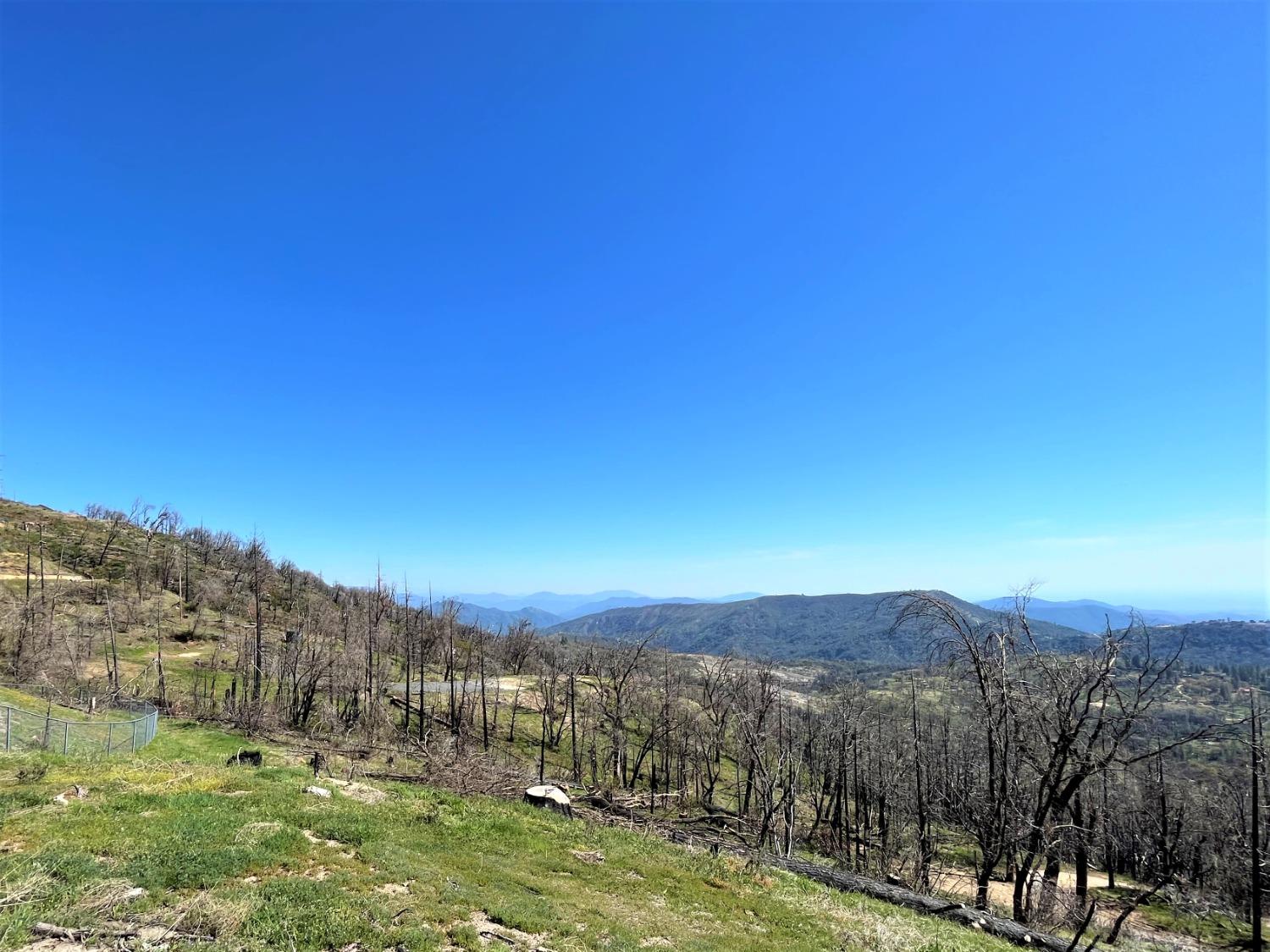 36021 Cressman Road Shaver Lake, CA 93602 - Photo 13 of 18 a view of a town with mountains in the background