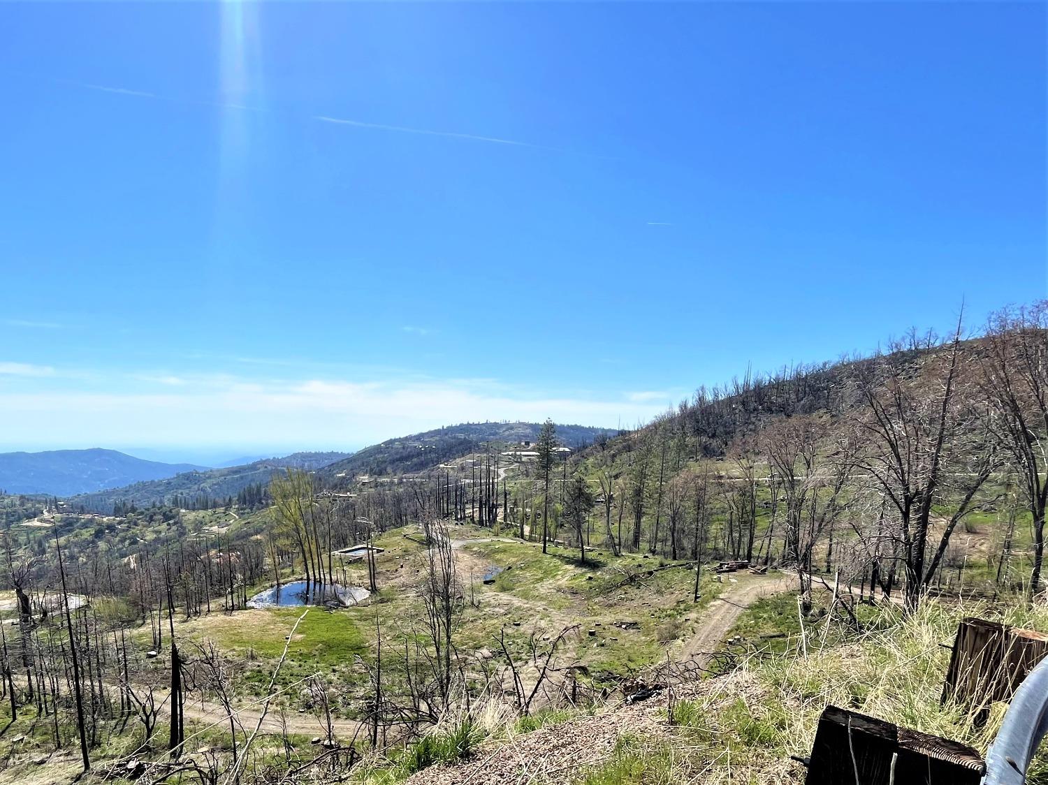 36021 Cressman Road Shaver Lake, CA 93602 - Photo 18 of 18 a view of a town with mountains in the background
