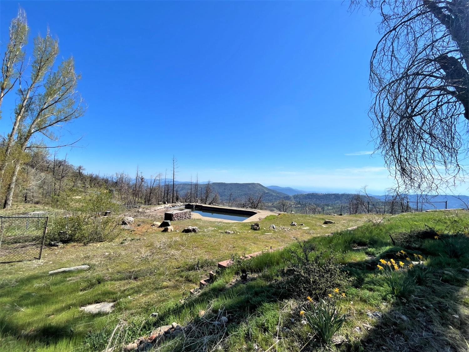 36021 Cressman Road Shaver Lake, CA 93602 - Photo 5 of 18 a view of a town with mountains in the background