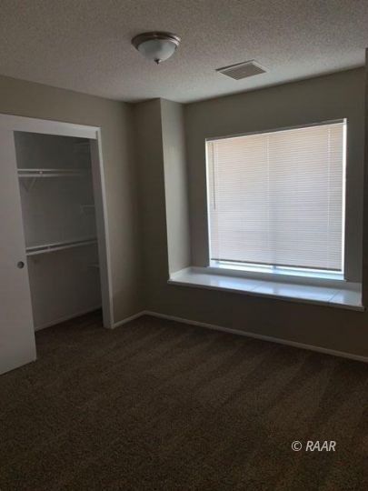 316 West Felspar Avenue Ridgecrest, CA 93555 - Photo 10 of 16 a view of an empty room with a window
