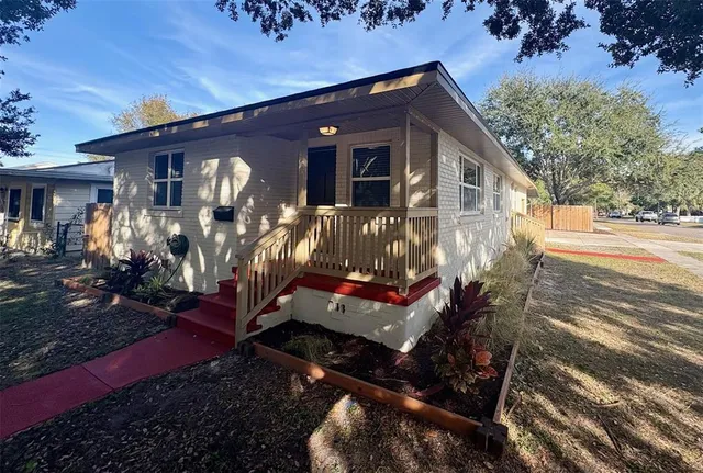 a front view of house with yard outdoor seating and barbeque oven