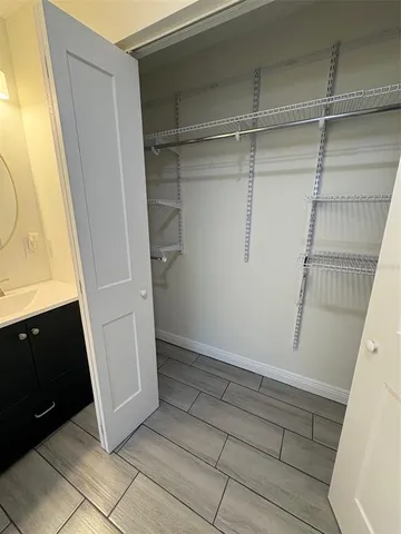 a bathroom with a sink a mirror and shower