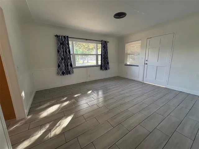 a view of empty room with windows