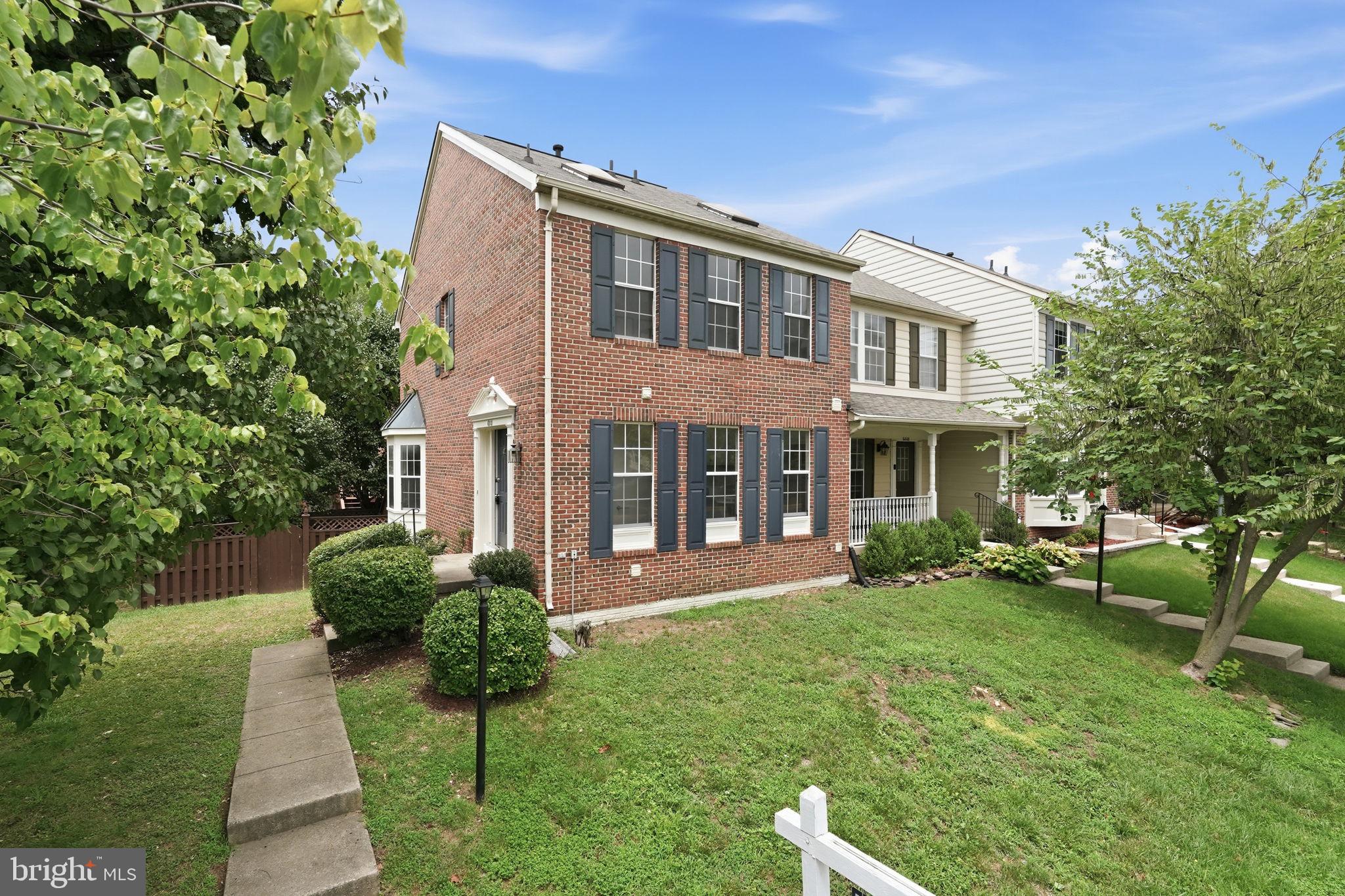 6010 Bingley Road Alexandria, VA 22315 - Photo 2 of 50 a front view of a house with a yard table and chairs