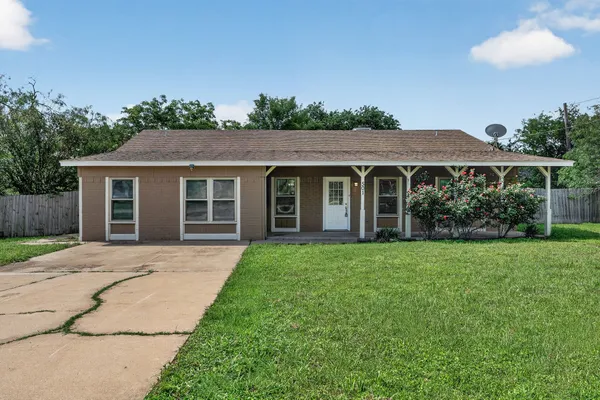 front view of a house with a yard
