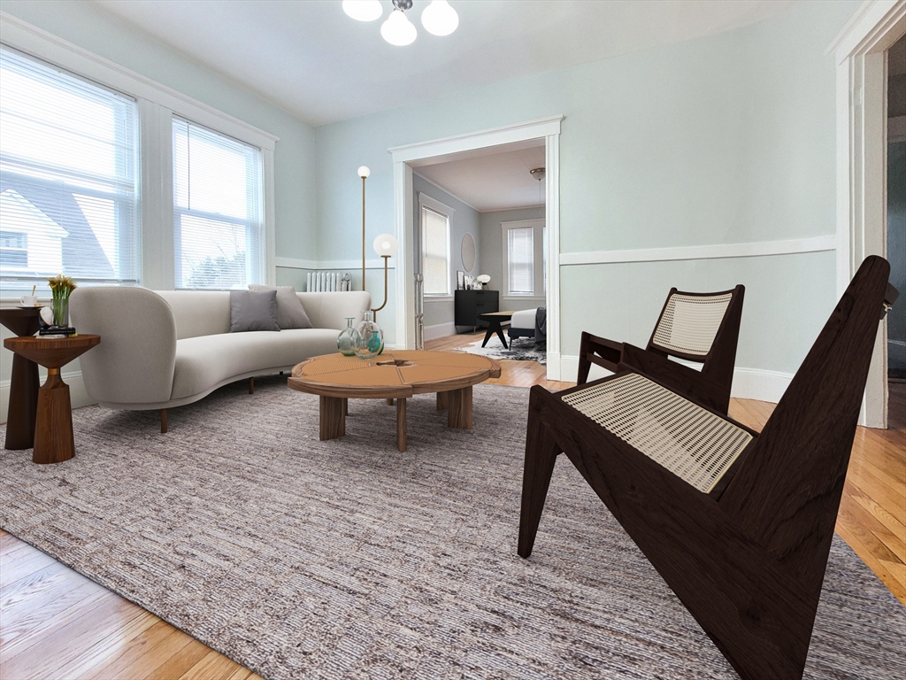 37-39 Juniper Street, Unit 39 1 Boston, MA 02119 - Photo 2 of 12 a living room with furniture and a window