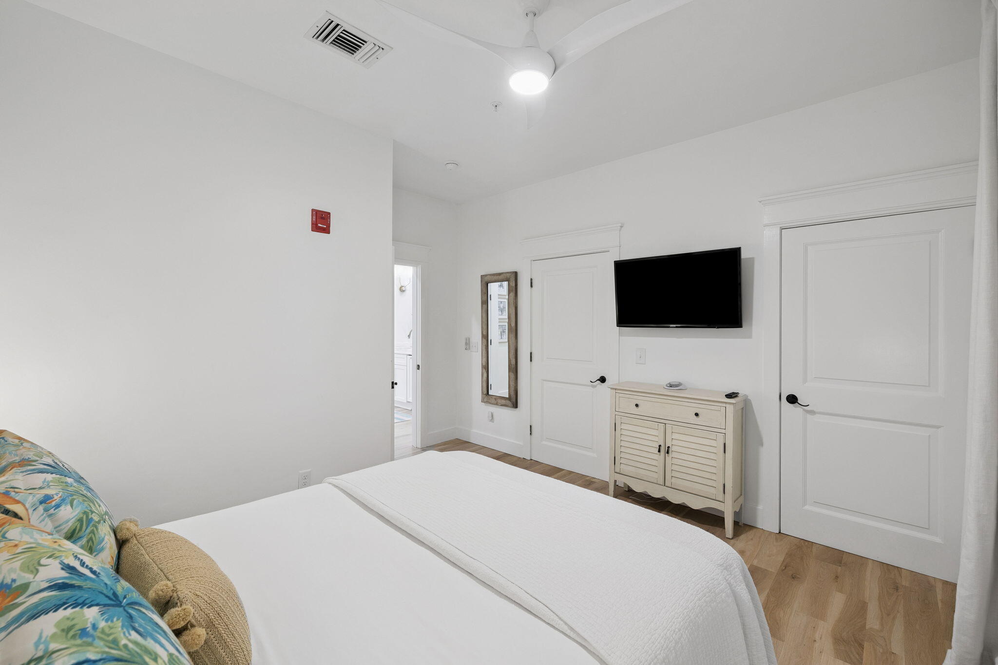 45 St Augustine Street, Unit 9101 Inlet Beach, FL 32461 - Photo 21 of 32 a bedroom with a flat screen tv and a bed