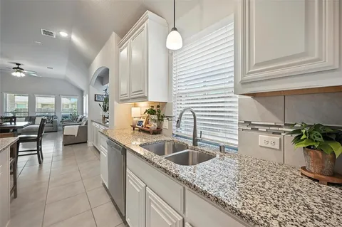 a living room with furniture a dining table and chairs