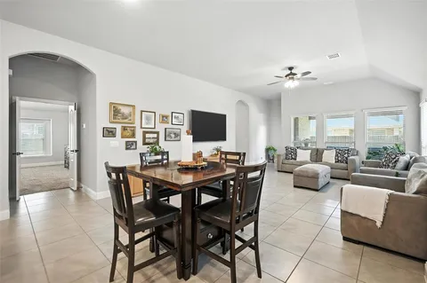 a view of a dining room with furniture and a livingroom
