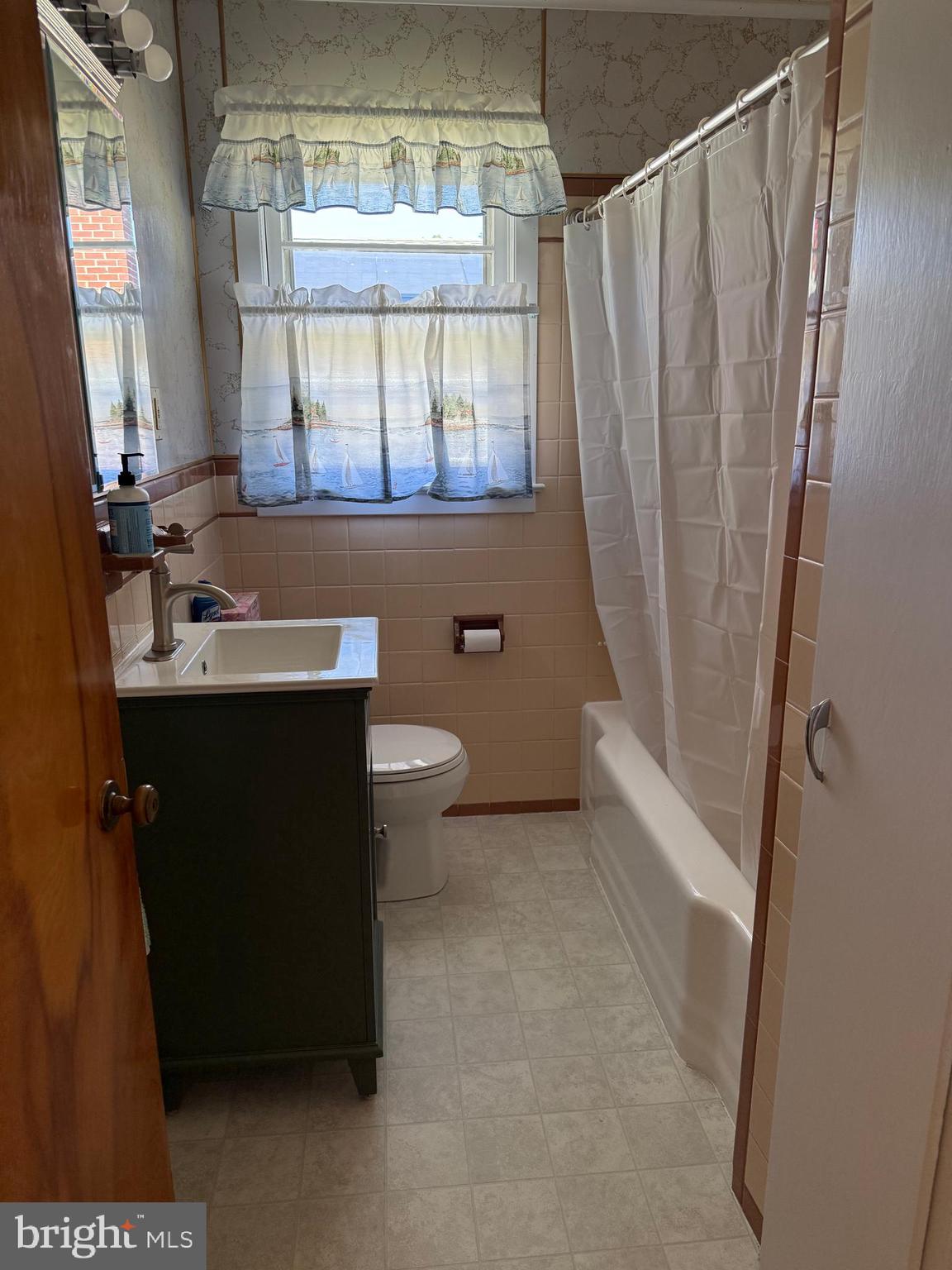 34 Townsend Avenue Bridgeton, NJ 08302 - Photo 17 of 23 a bathroom with a sink toilet and window