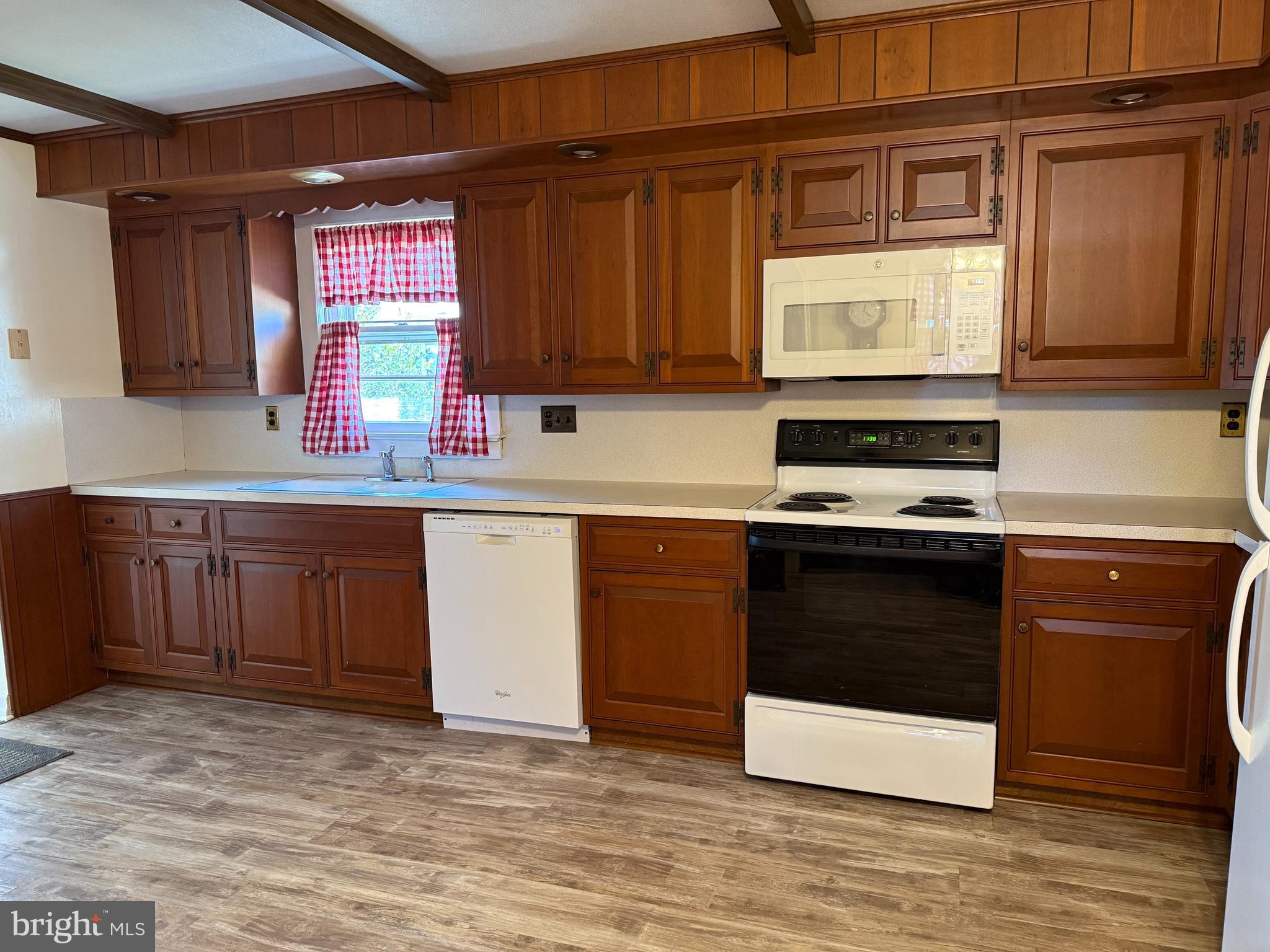 34 Townsend Avenue Bridgeton, NJ 08302 - Photo 4 of 23 a kitchen with stainless steel appliances granite countertop a stove a sink and a microwave