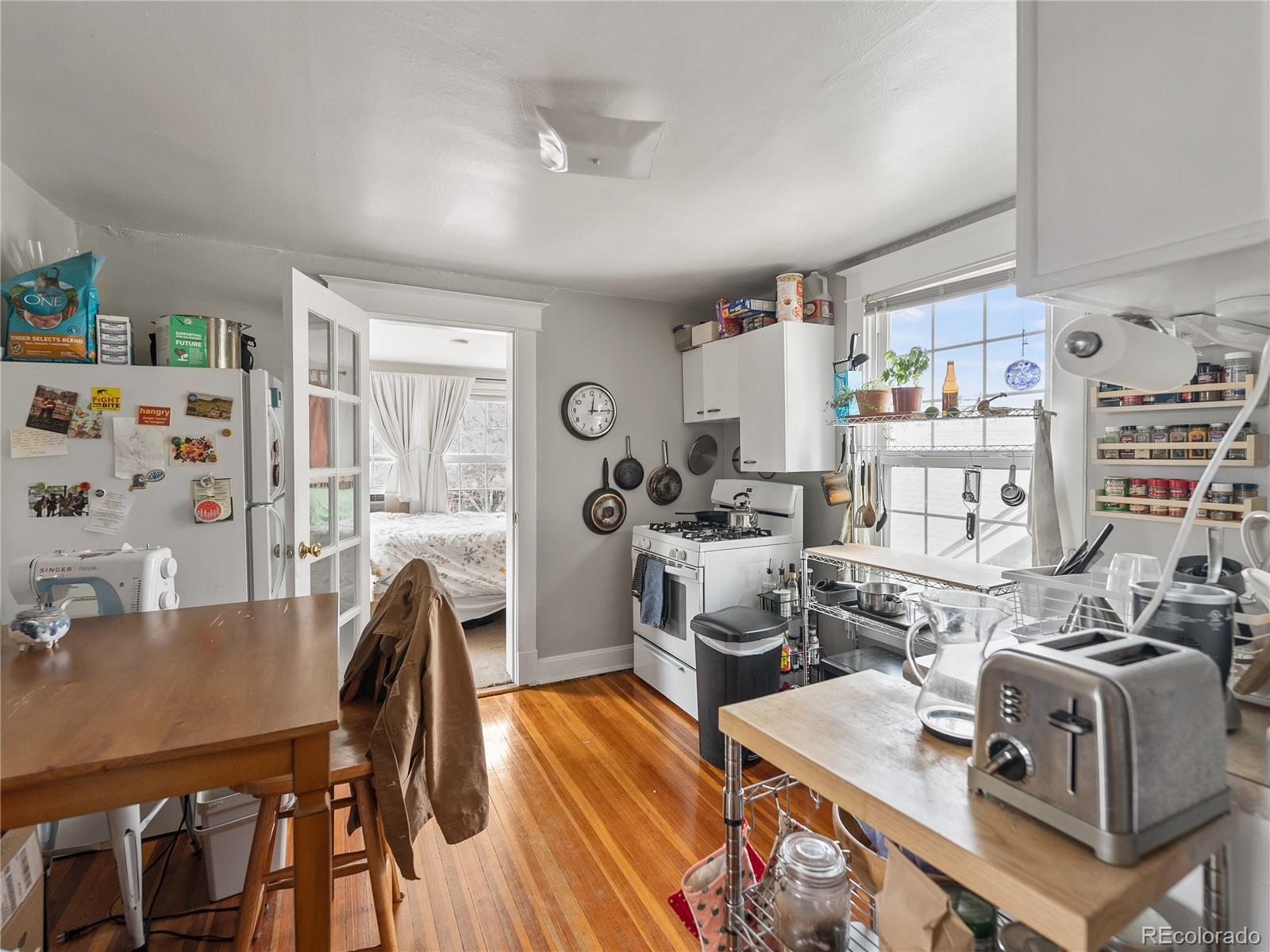Undisclosed Address Denver, CO 80206 - Photo 15 of 33 a living room with furniture and a table