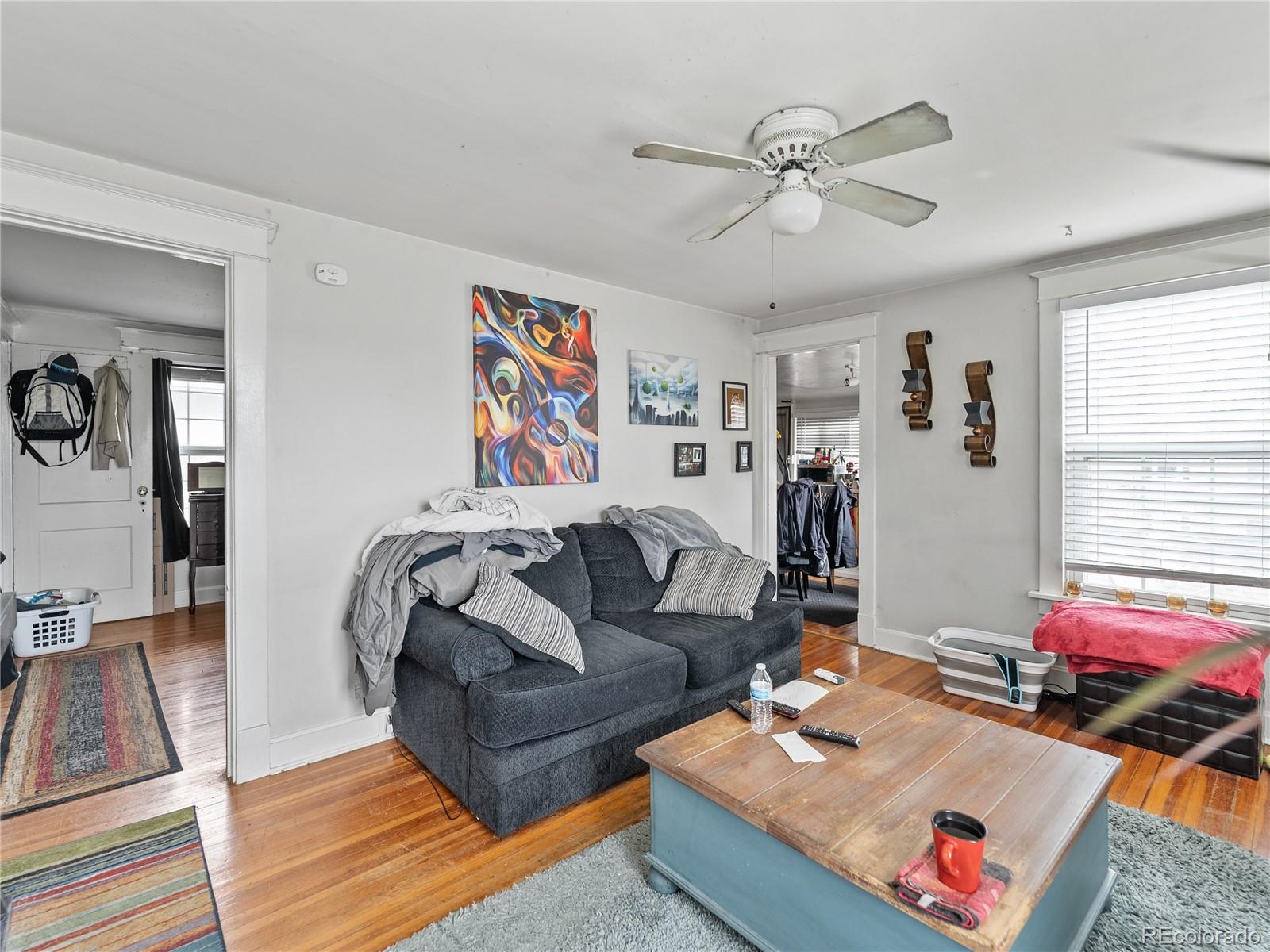 Undisclosed Address Denver, CO 80206 - Photo 20 of 33 a living room with furniture and wooden floor