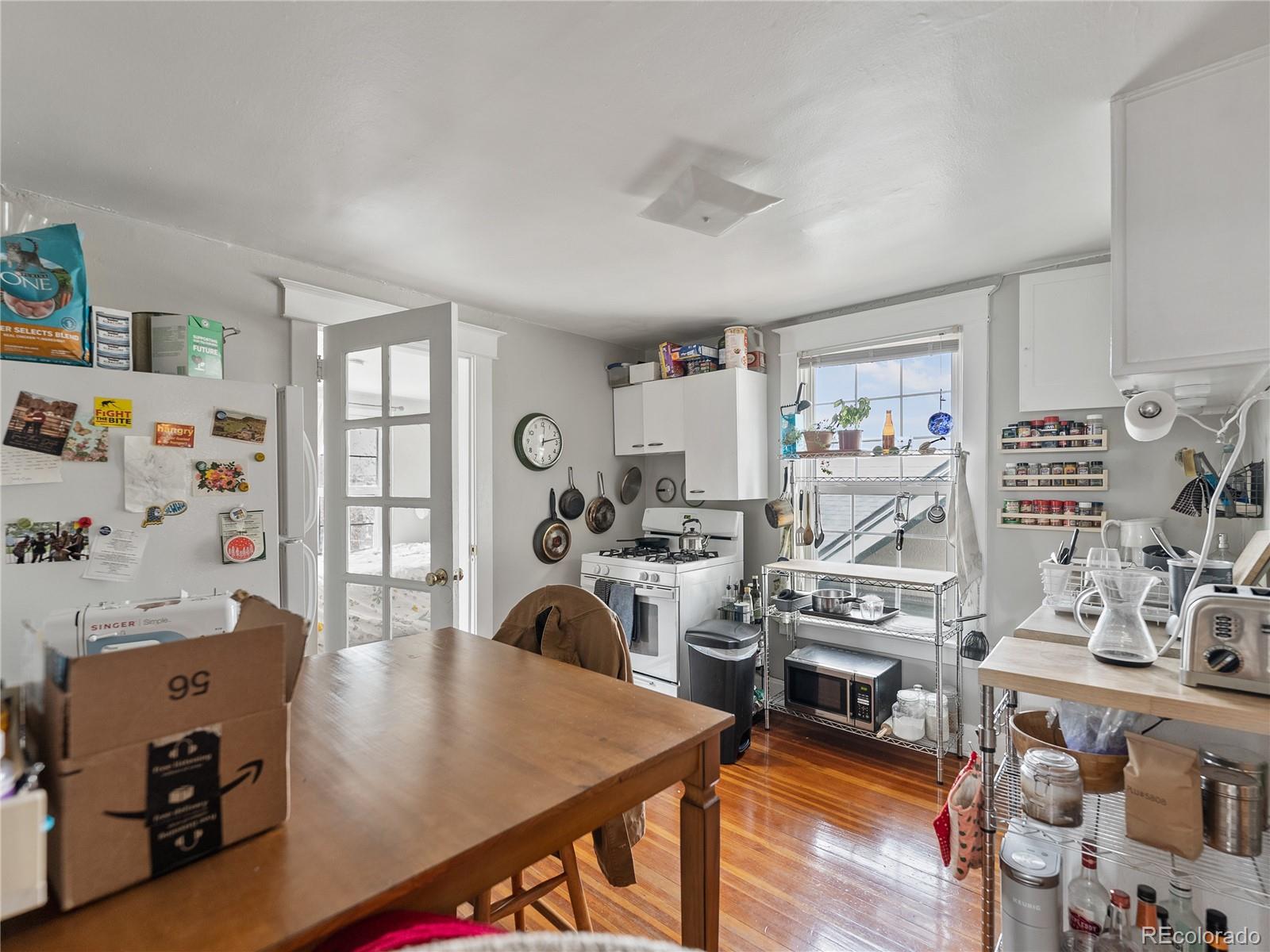 Undisclosed Address Denver, CO 80206 - Photo 26 of 33 a view of a workspace with furniture and a workspace