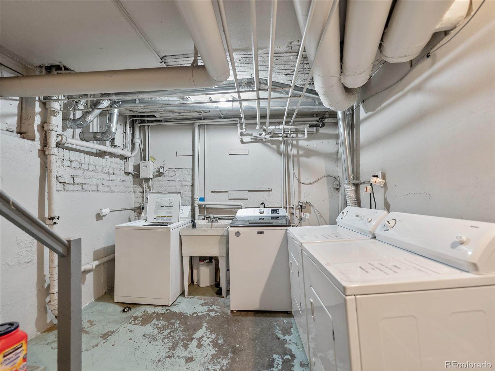 Undisclosed Address Denver, CO 80206 - Photo 29 of 33 a utility room with dryer and washer