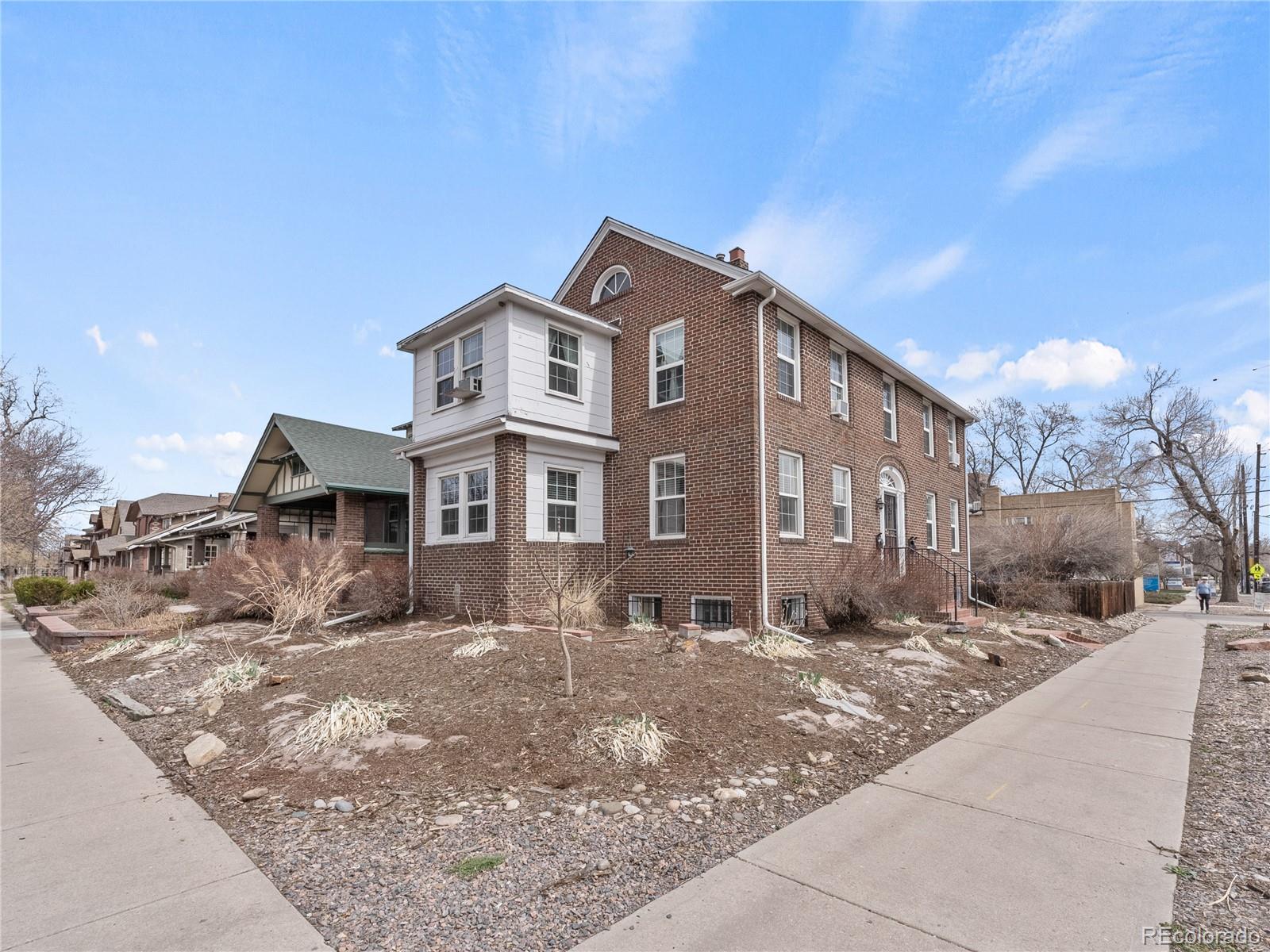 Undisclosed Address Denver, CO 80206 - Photo 30 of 33 a front view of a house with a yard