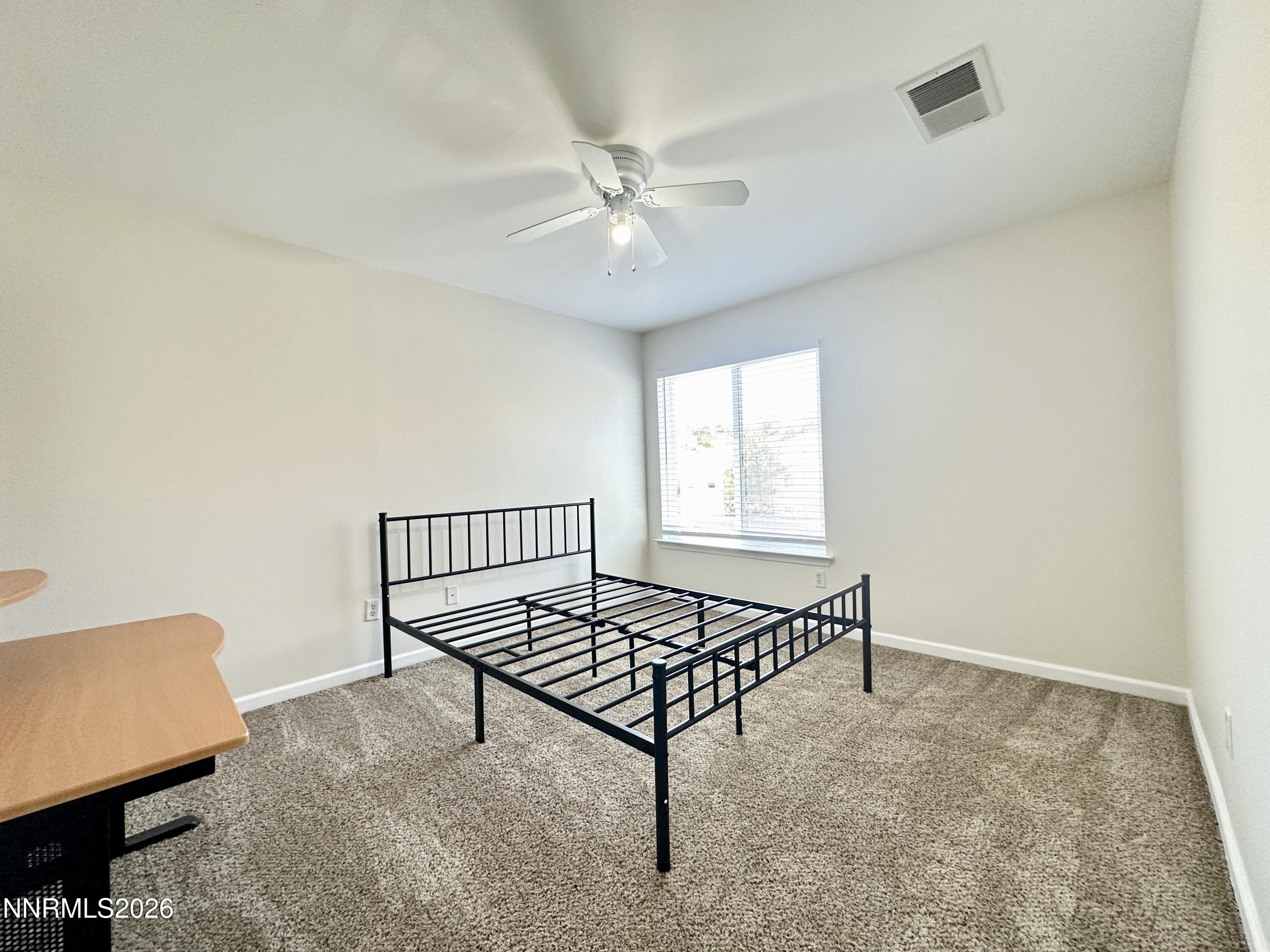 200 Talus Way, Unit 434 Reno, NV 89503 - Photo 11 of 21 a living room with a baby bed furniture and a window