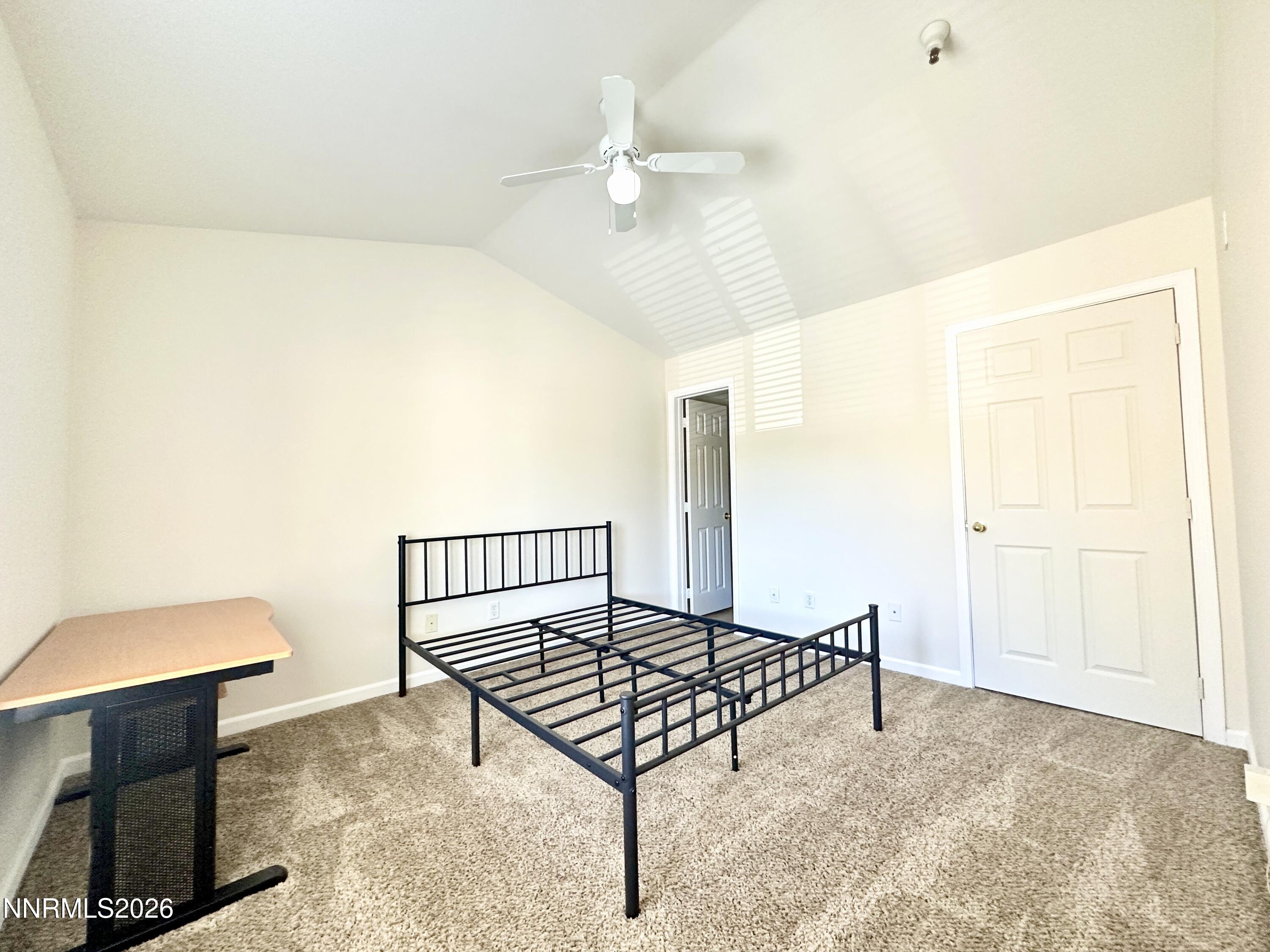 200 Talus Way, Unit 434 Reno, NV 89503 - Photo 14 of 21 a living room with a bed furniture and a window