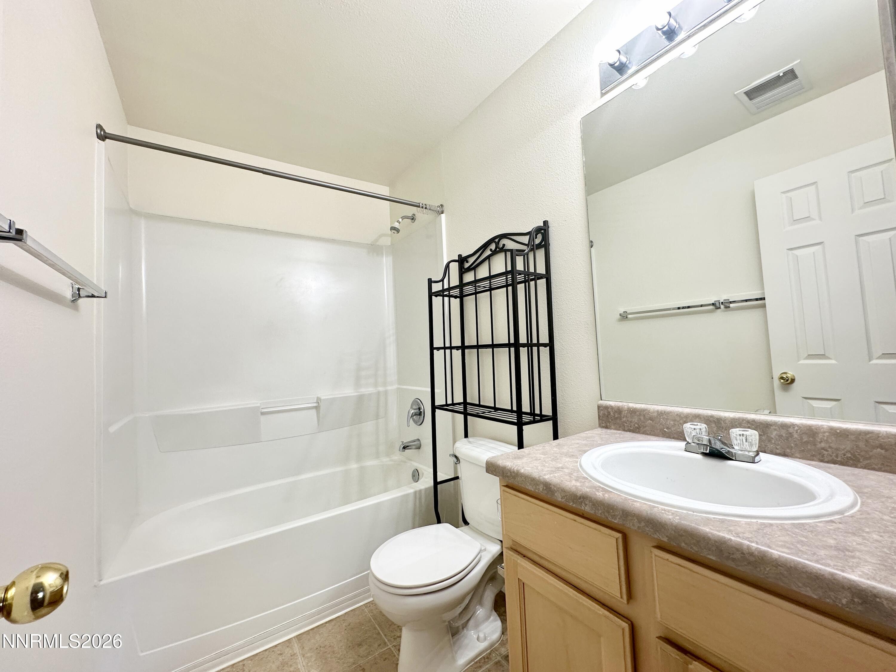 200 Talus Way, Unit 434 Reno, NV 89503 - Photo 16 of 21 a bathroom with a sink toilet and shower