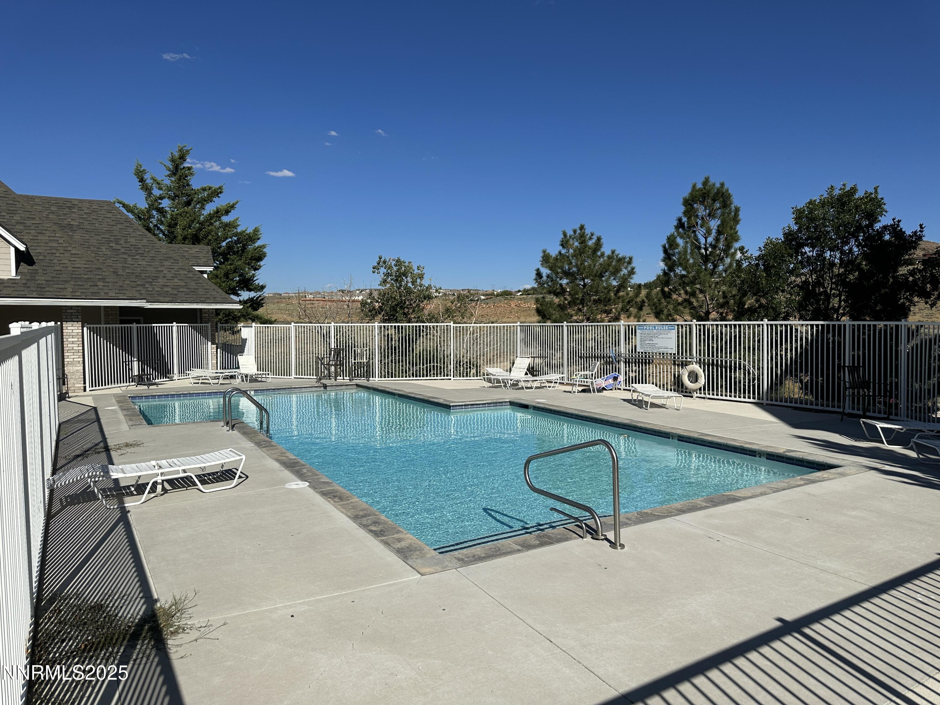 200 Talus Way, Unit 434 Reno, NV 89503 - Photo 18 of 21 a view of a swimming pool with a patio
