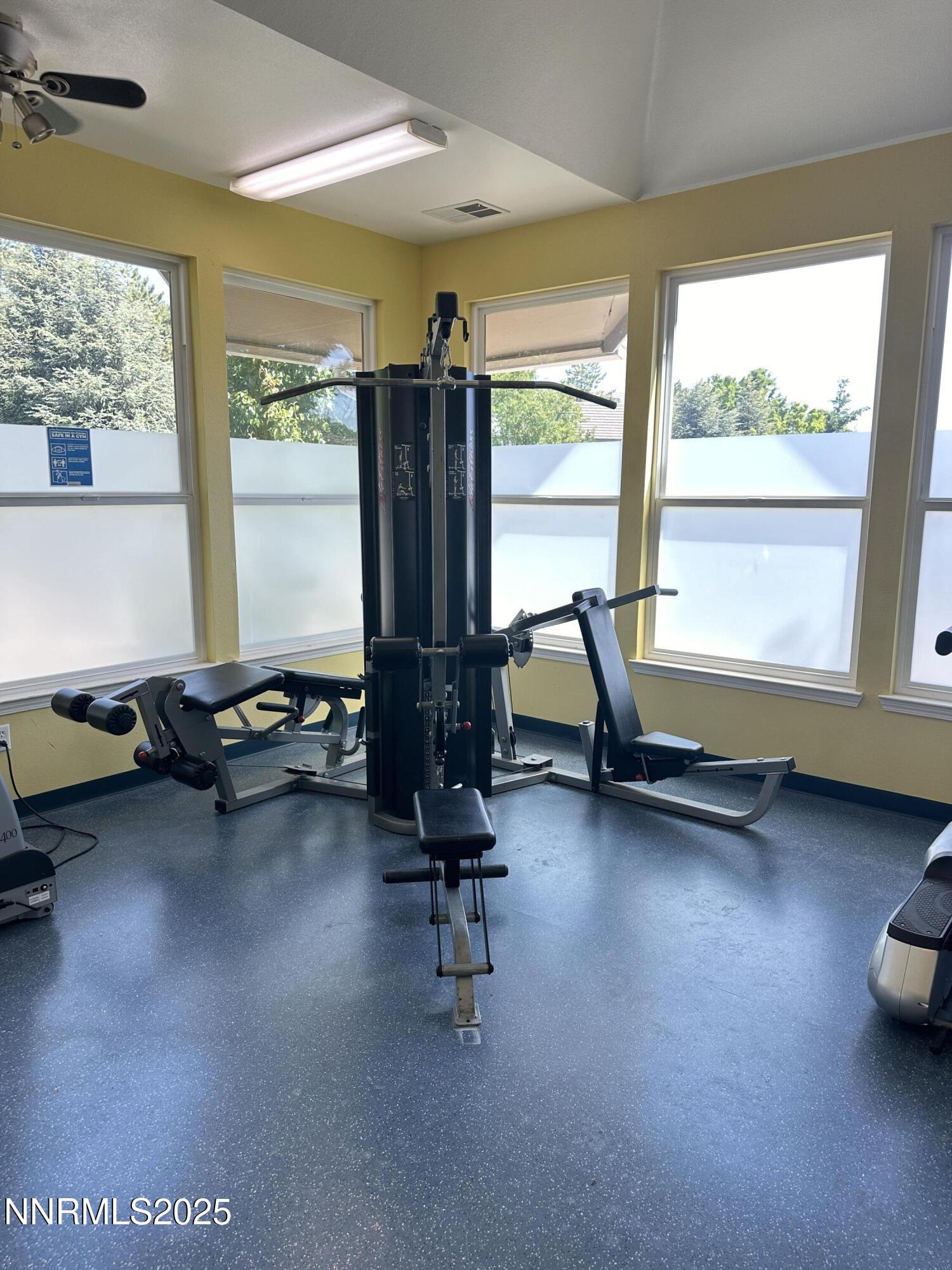200 Talus Way, Unit 434 Reno, NV 89503 - Photo 20 of 21 a view of a room with gym equipment and floor to ceiling window