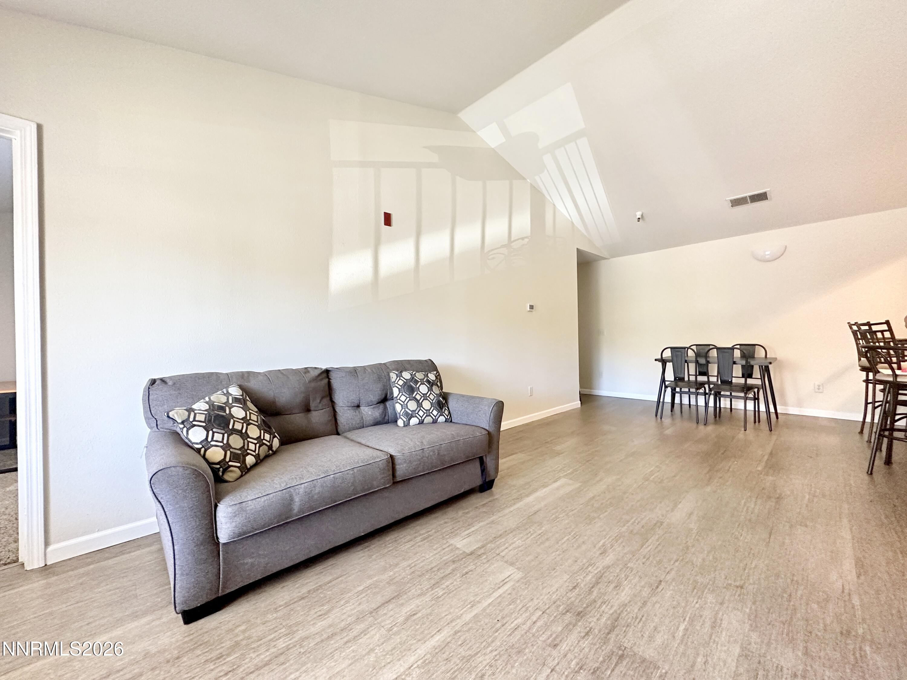 200 Talus Way, Unit 434 Reno, NV 89503 - Photo 2 of 21 a living room with furniture and a wooden floor