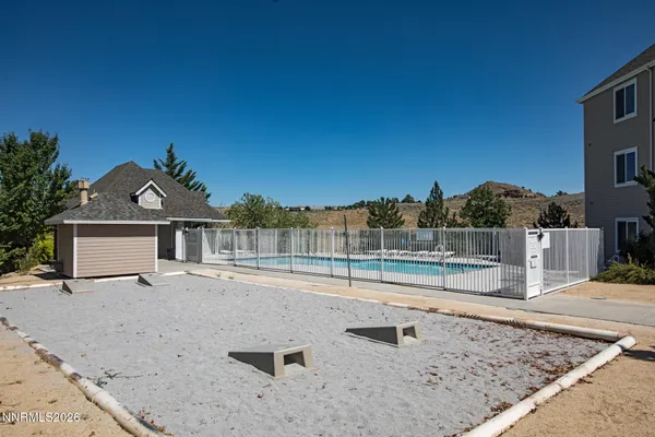 a view of swimming pool with a yard