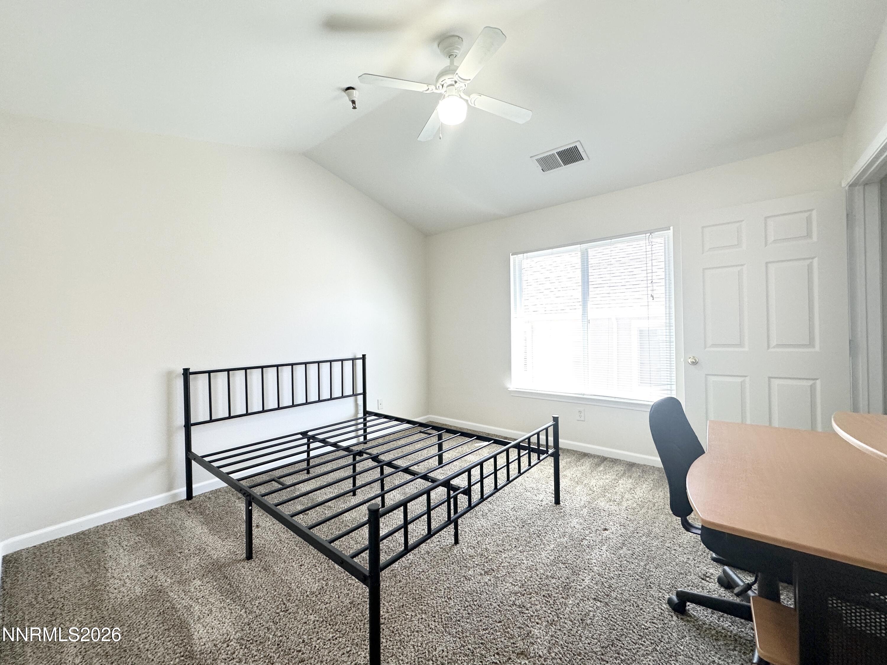 200 Talus Way, Unit 434 Reno, NV 89503 - Photo 5 of 21 a bedroom with furniture and a window