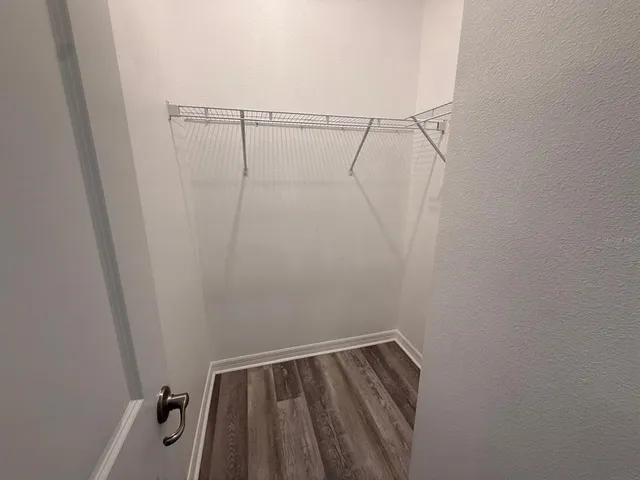 a view of a room with racks on the wall