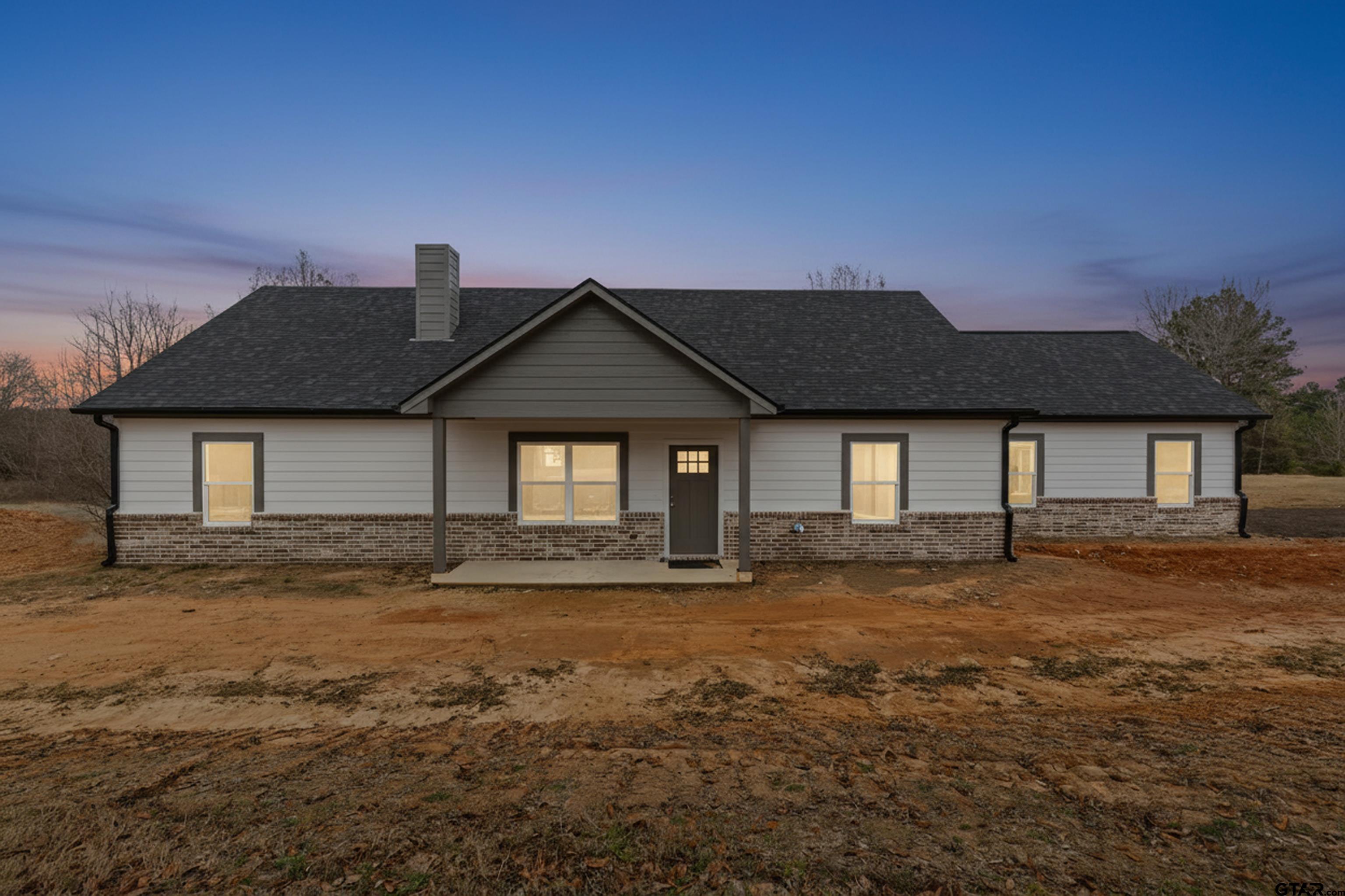 9934 Bob O Link Road Gladewater, TX 75647 - Photo 1 of 37 a front view of a house with a yard