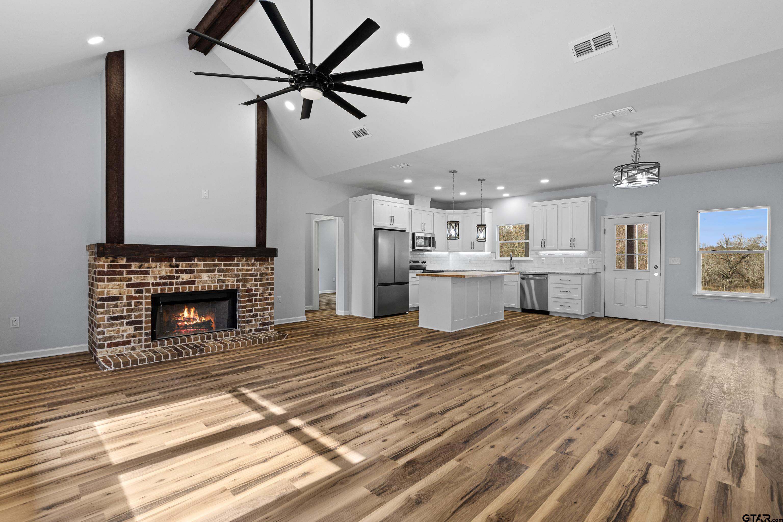 9934 Bob O Link Road Gladewater, TX 75647 - Photo 11 of 37 a view of a kitchen with furniture and a fireplace