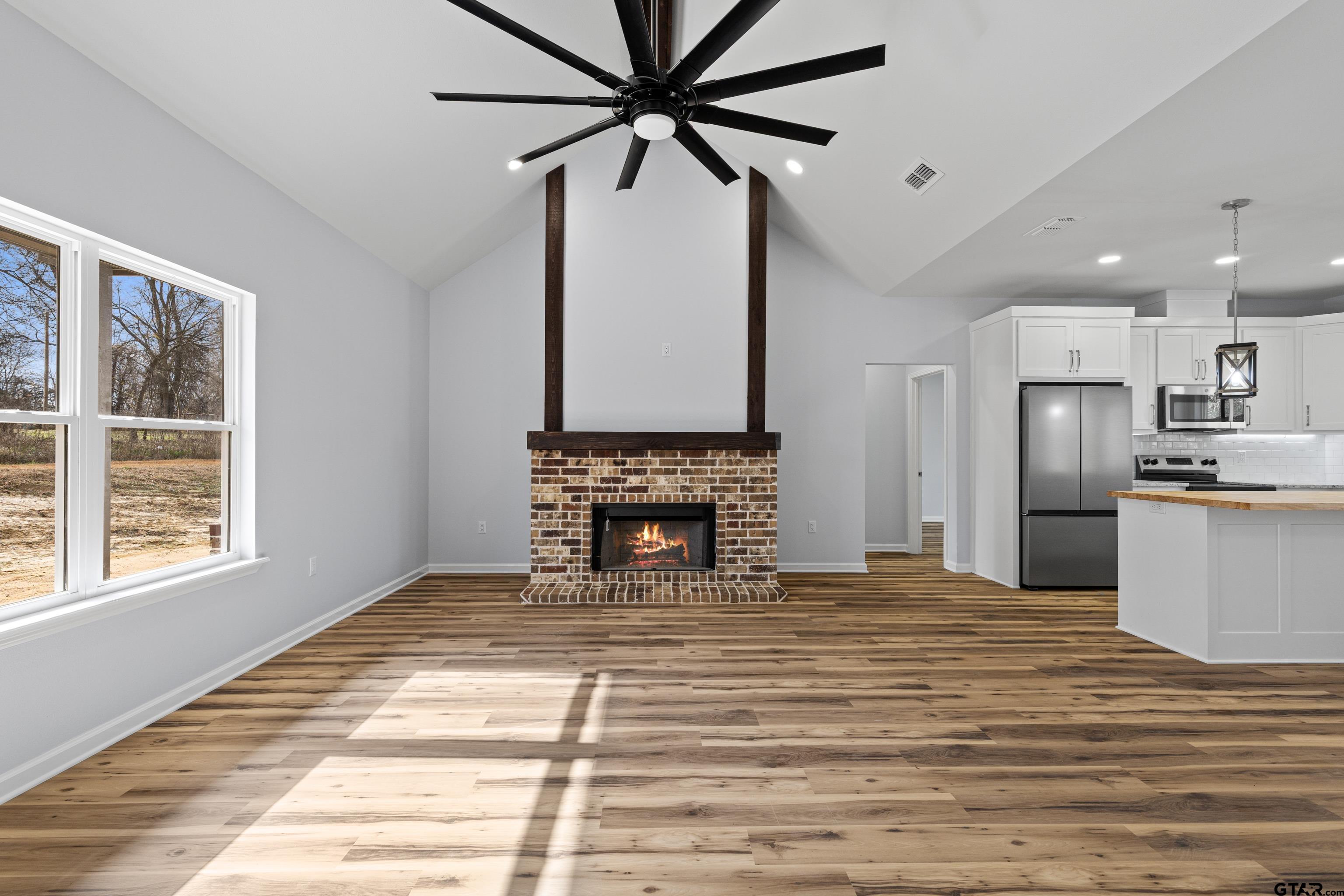 9934 Bob O Link Road Gladewater, TX 75647 - Photo 12 of 37 a view of a kitchen with a sink and a fireplace