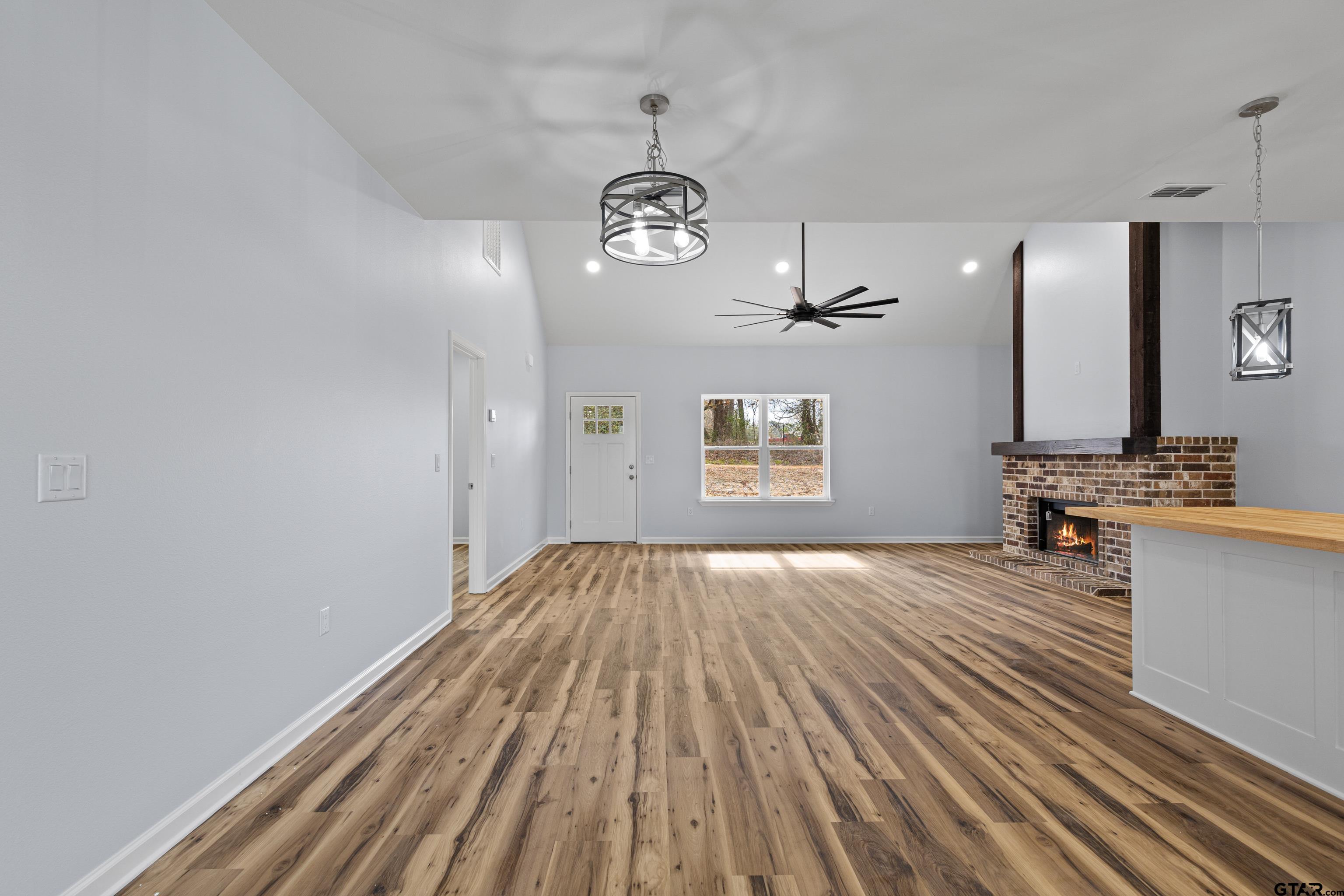 9934 Bob O Link Road Gladewater, TX 75647 - Photo 13 of 37 a view of empty room with wooden floor