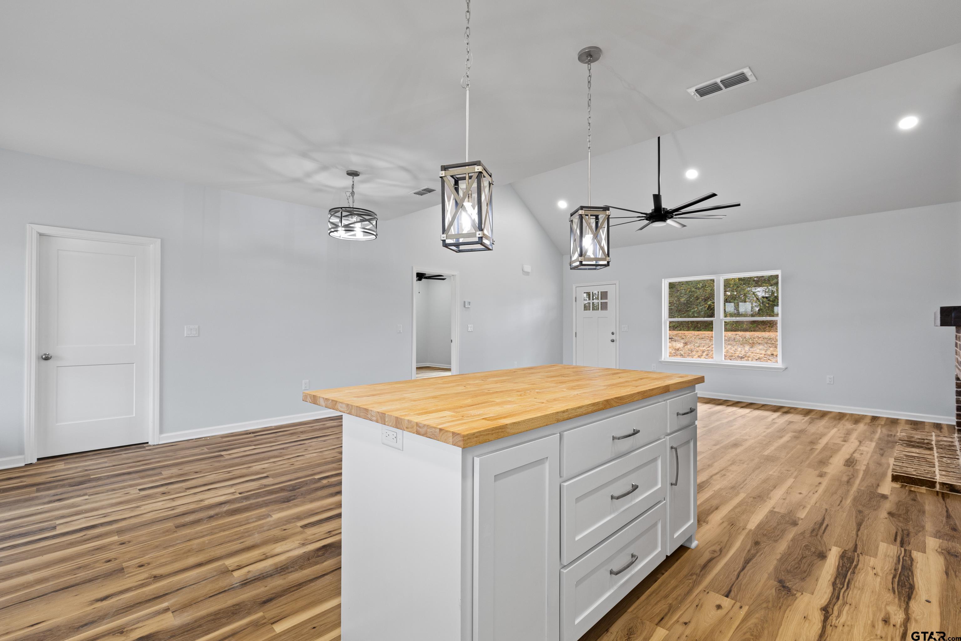 9934 Bob O Link Road Gladewater, TX 75647 - Photo 17 of 37 a kitchen with a stove and a wooden floor
