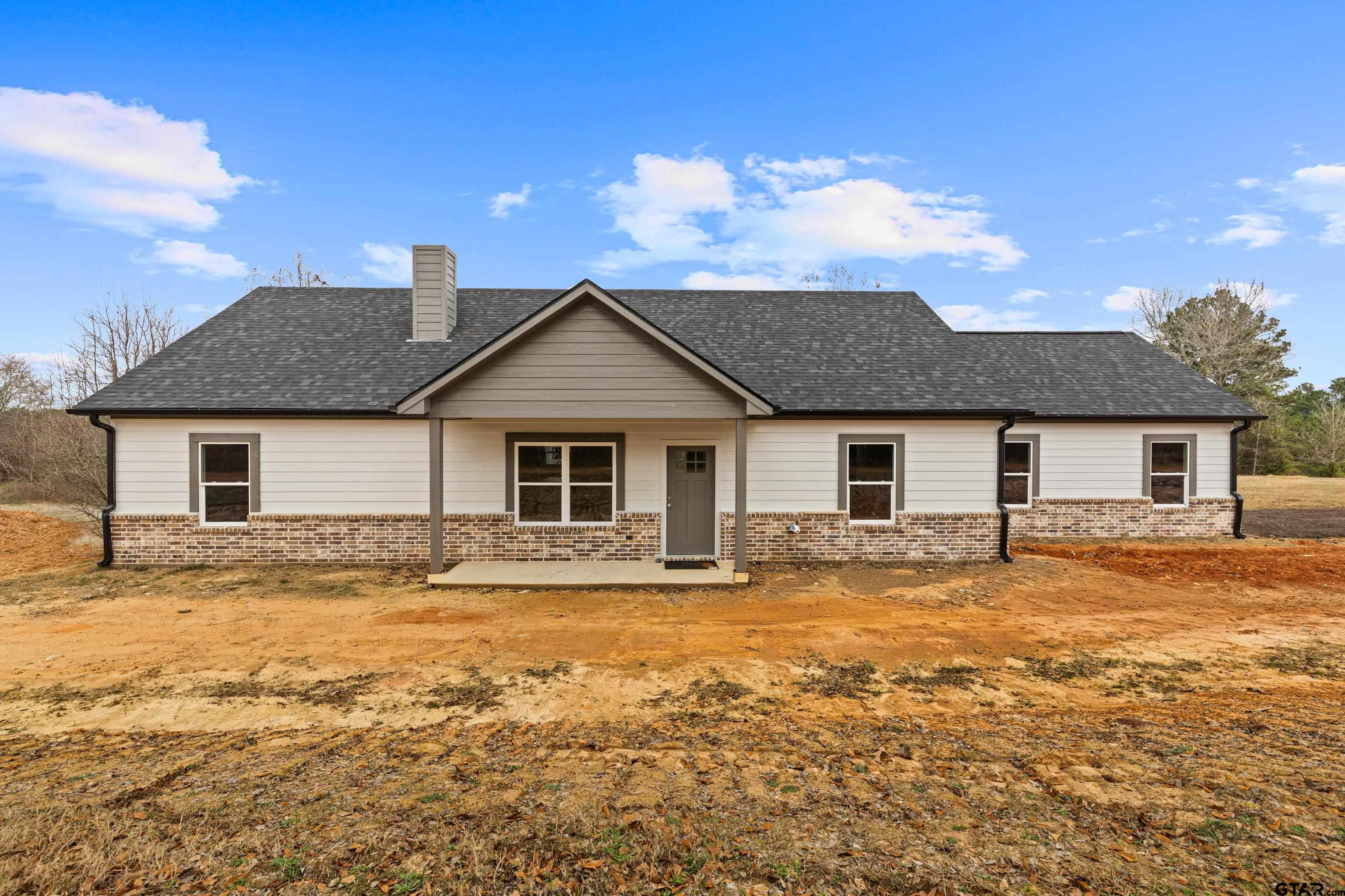 9934 Bob O Link Road Gladewater, TX 75647 - Photo 3 of 37 a front view of a house with a yard