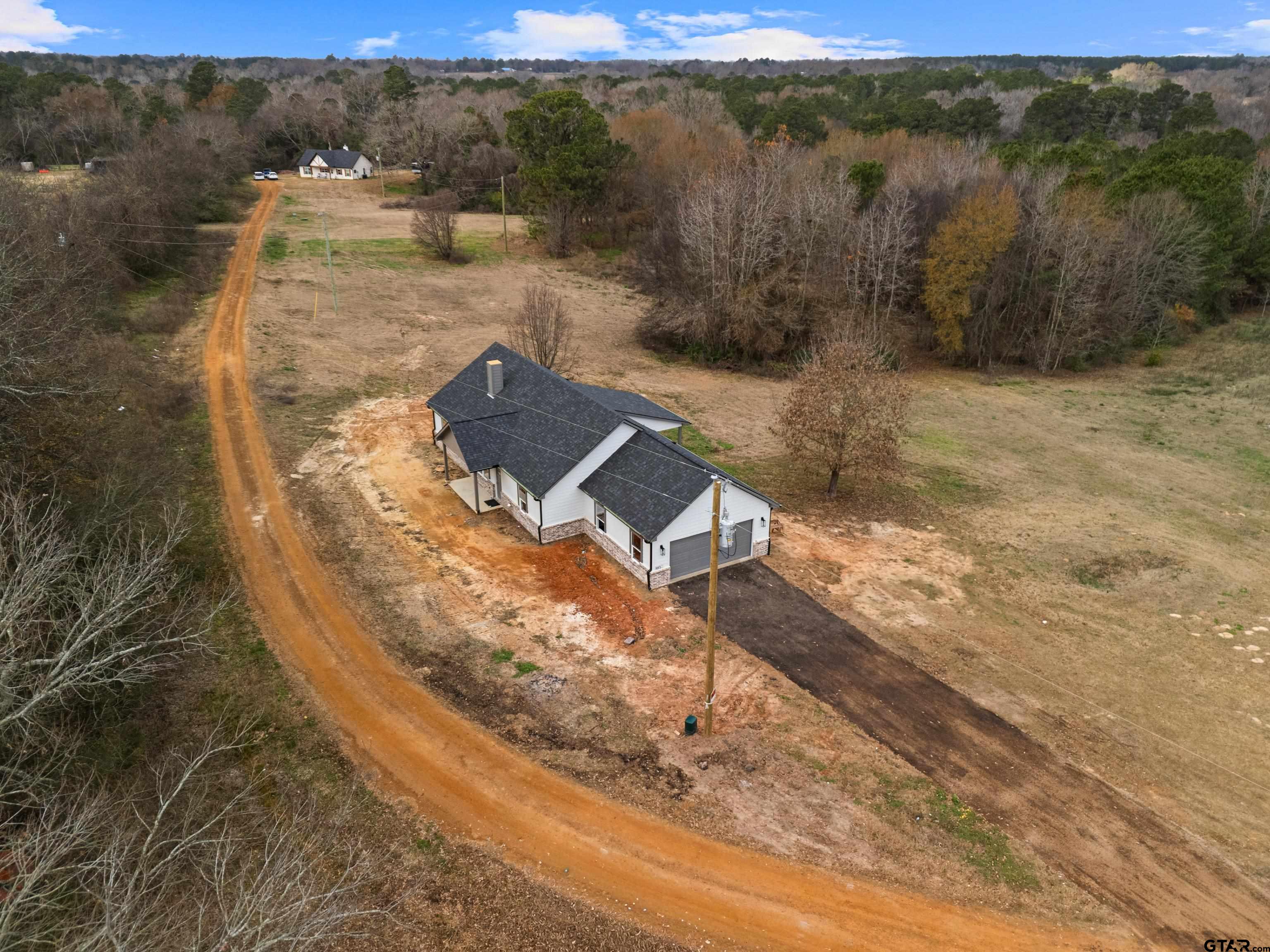 9934 Bob O Link Road Gladewater, TX 75647 - Photo 36 of 37 a view of a yard with wooden fence