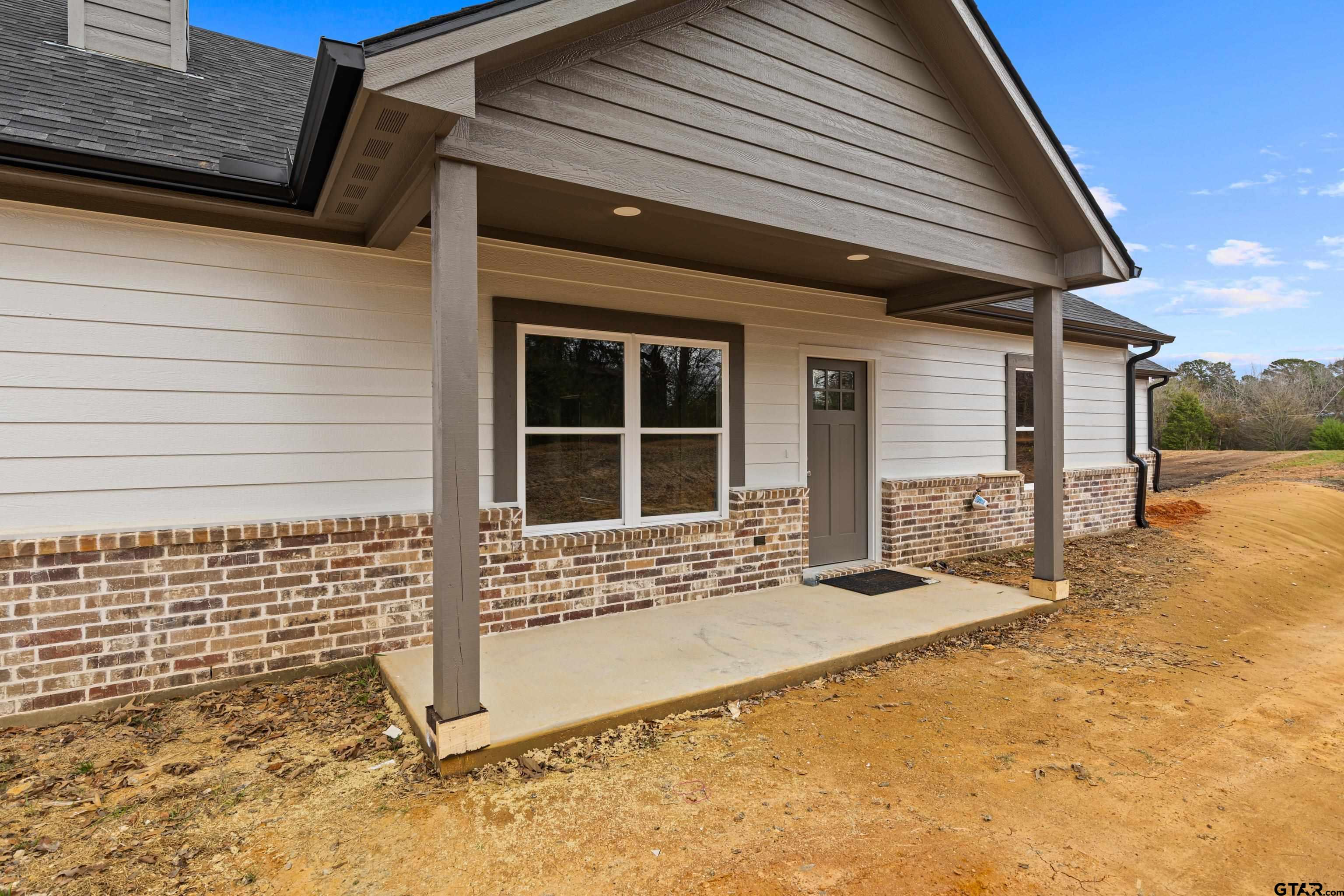 9934 Bob O Link Road Gladewater, TX 75647 - Photo 5 of 37 a front view of a house with a large window