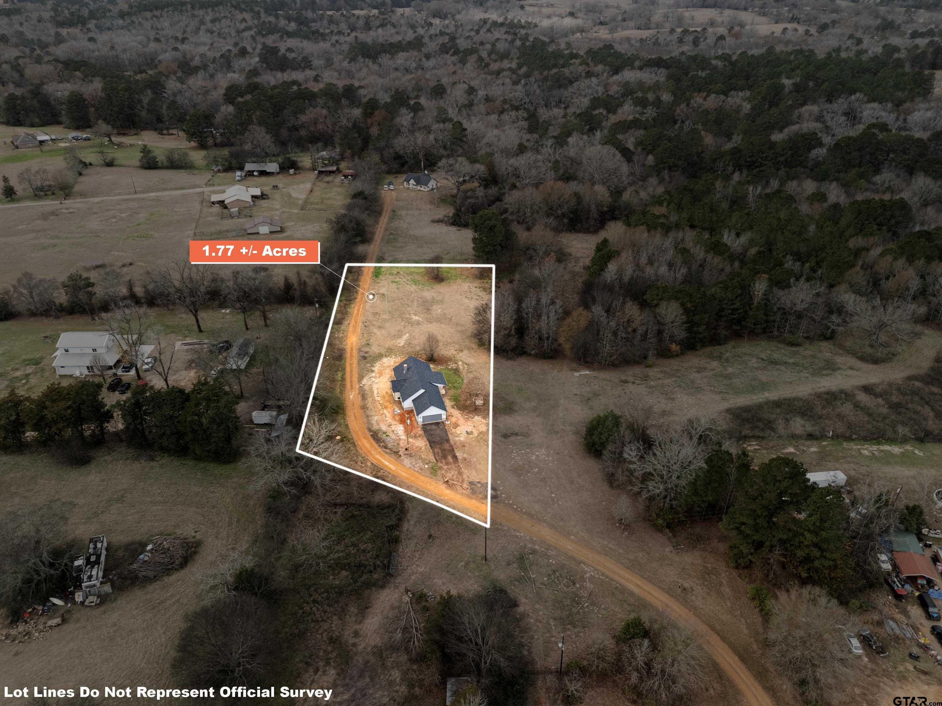 9934 Bob O Link Road Gladewater, TX 75647 - Photo 8 of 37 an aerial view of a red and white house with a yard and parking space