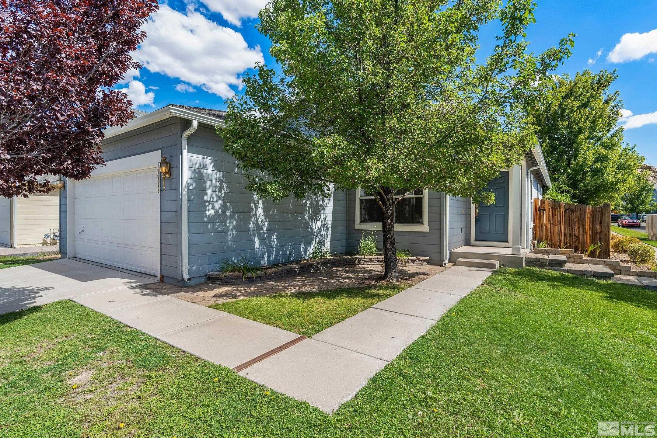 7748 Tulear Street Reno, NV 89506 - Photo 3 of 23 a view of a house with backyard and tree