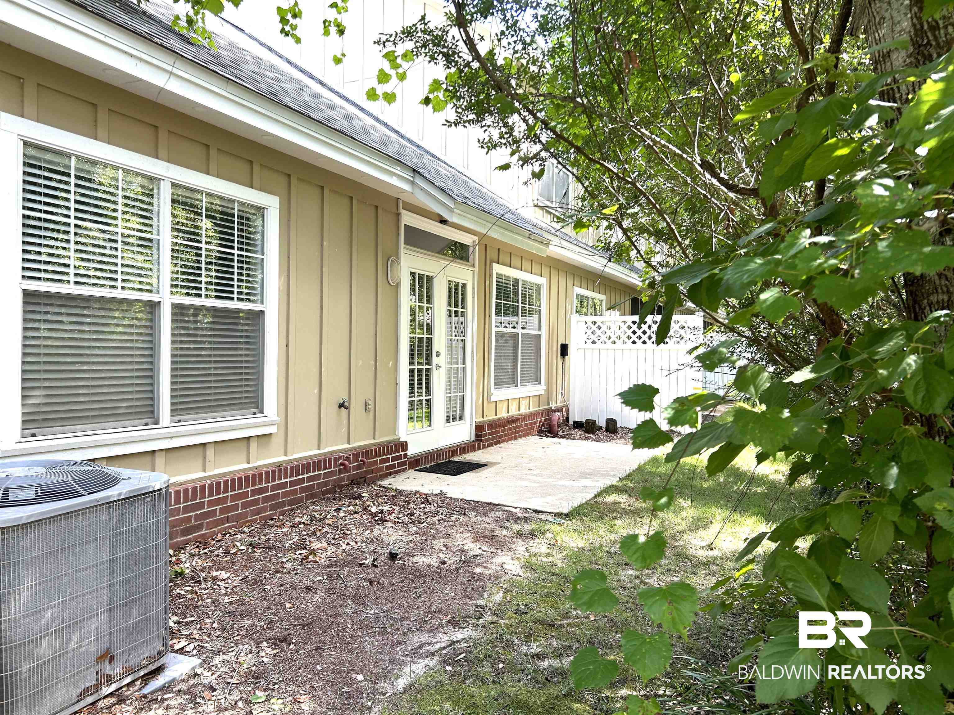430 West Fort Morgan Road, Unit 404 Gulf Shores, AL 36542 - Photo 27 of 31 Exterior space with central air condition unit and a patio area