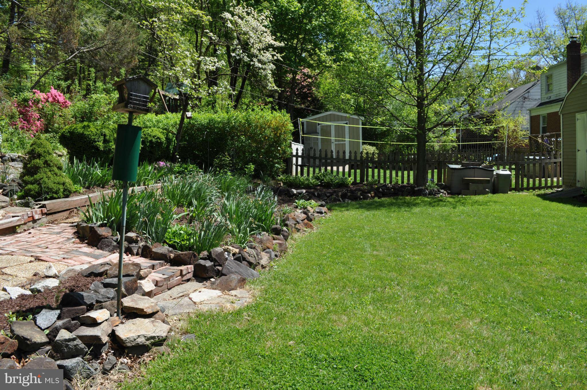 1021 Kingston Road Baltimore, MD 21208 - Photo 4 of 20 a view of a garden with a flower garden