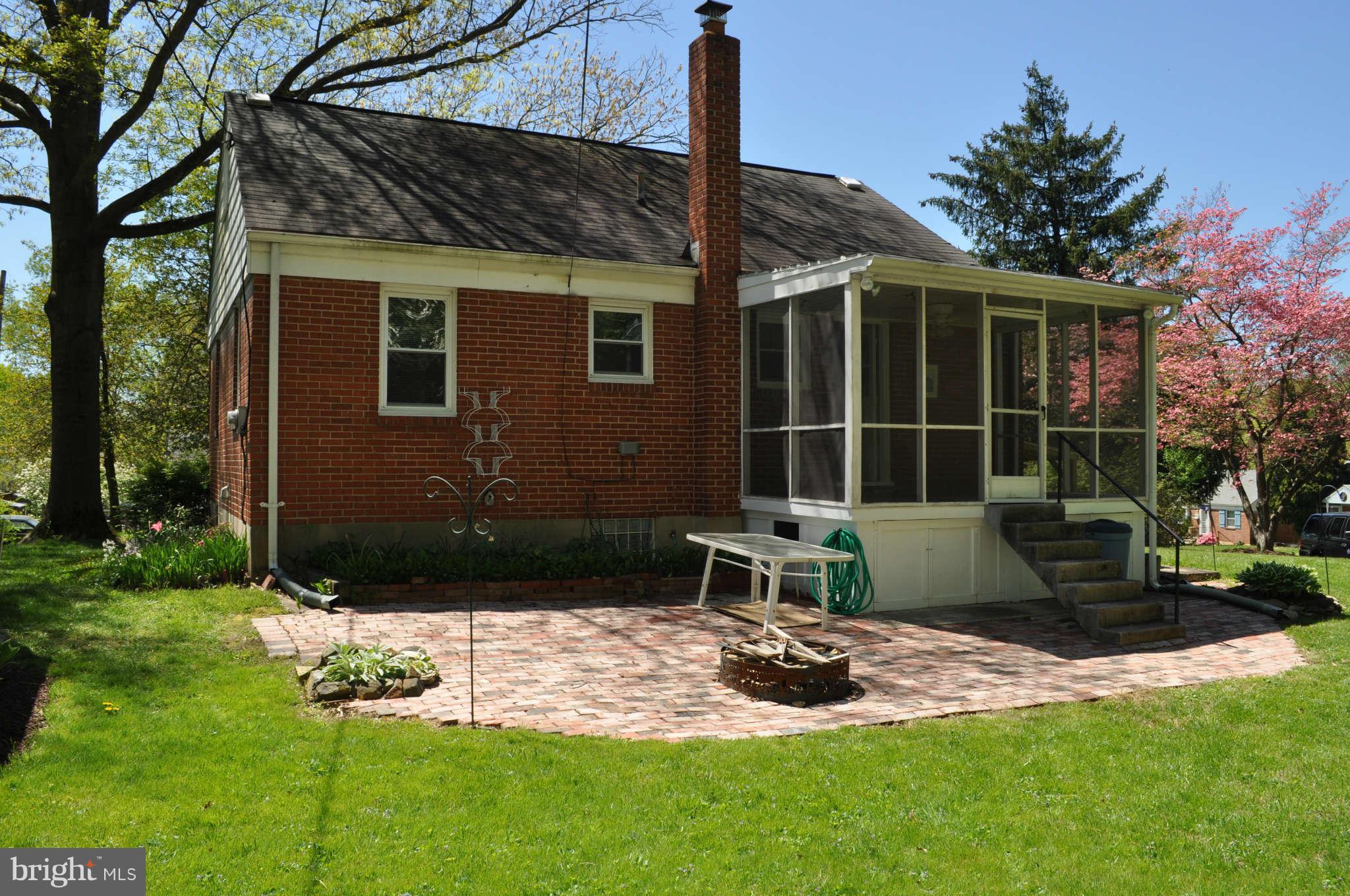 1021 Kingston Road Baltimore, MD 21208 - Photo 6 of 20 a front view of a house with garden