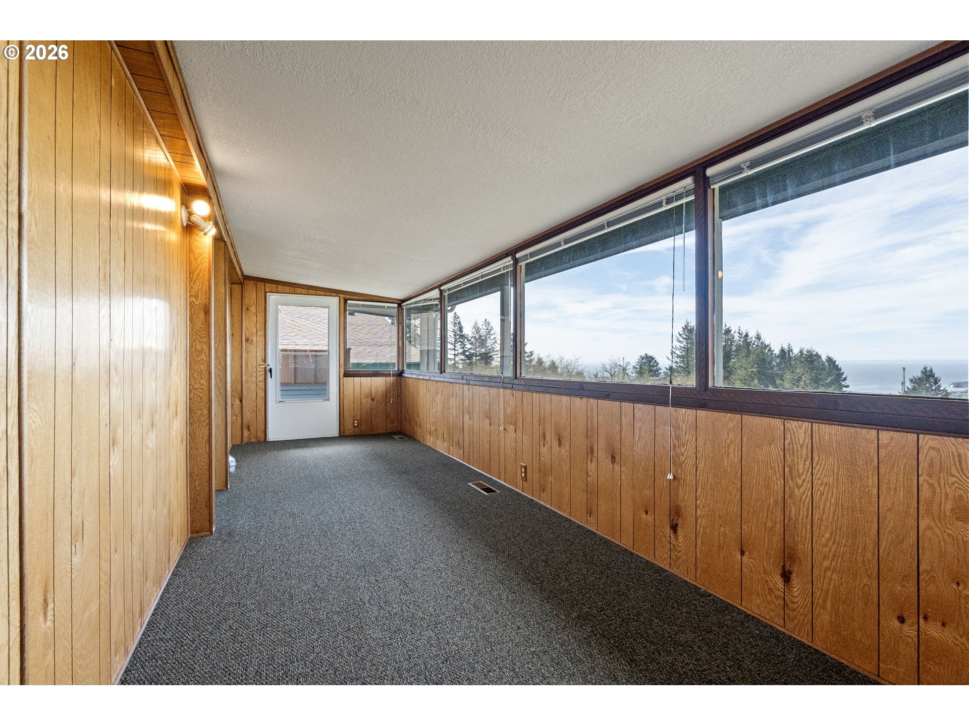 98041 Hallway Road, Unit 41 Brookings, OR 97415 - Photo 32 of 48 a view of an empty room with a window