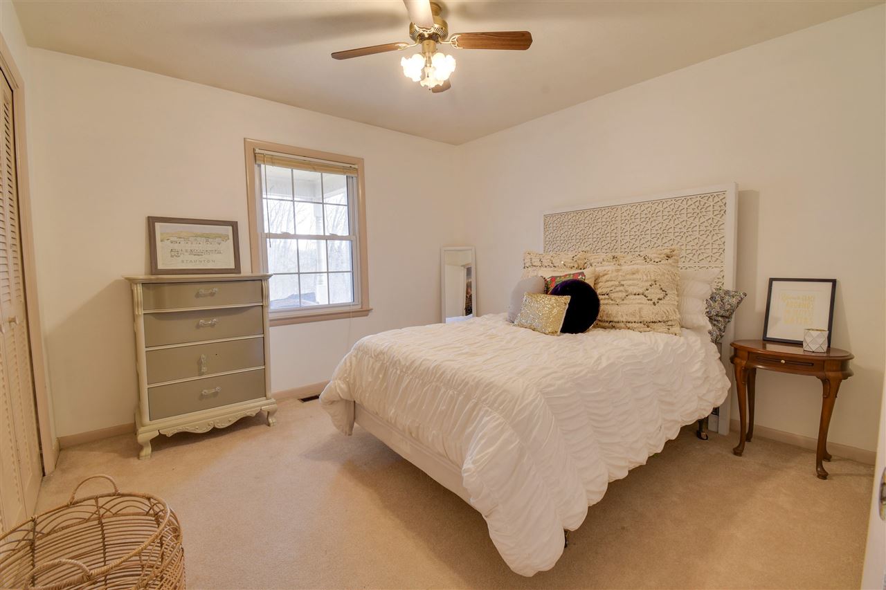 630 Bailey Road Fort Defiance, VA 24437 - Photo 11 of 22 a bedroom with a bed and a chandelier