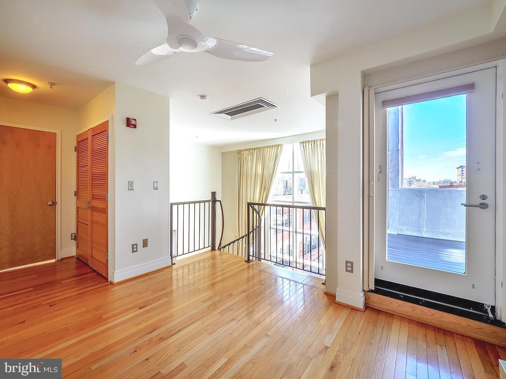 1530 14th Street Northwest, Unit 3B Washington, DC 20005 - Photo 11 of 28 an empty room with wooden floor and windows
